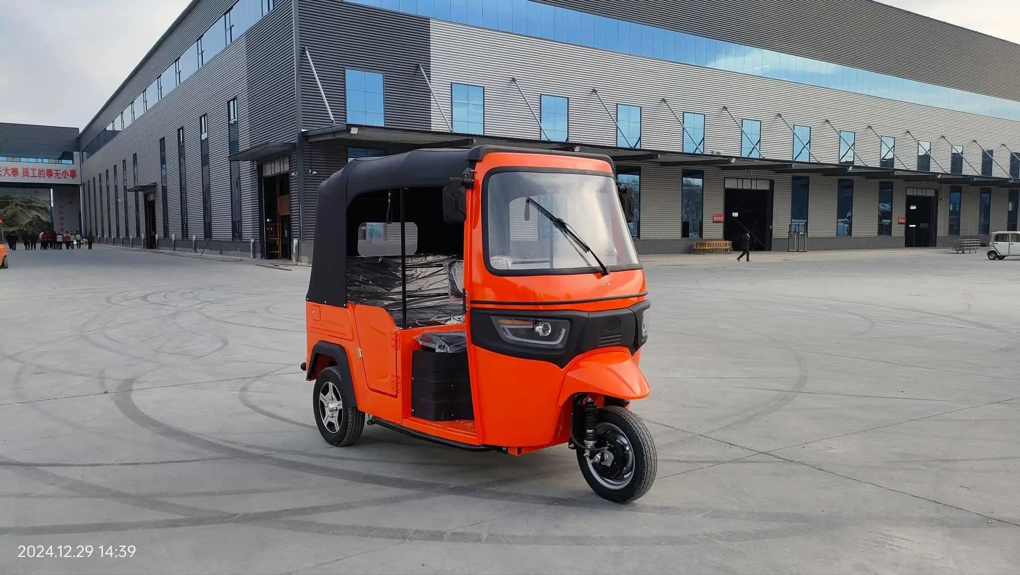 Orange Kekeh tricycle 2024 model front angle