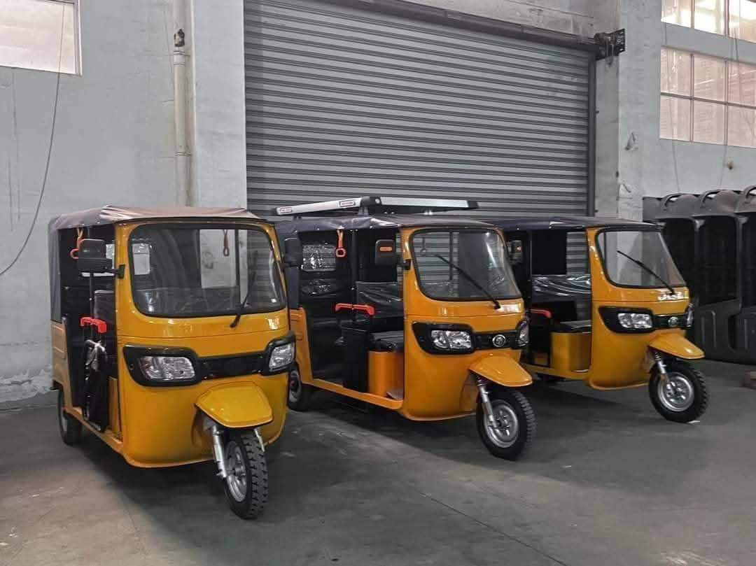 Yellow kekeh tricycle fleet in warehouse